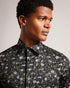 TORTED-Shirts-You can't go wrong with a button up shirt. TORTED is easy to dress up or down, and goes with practically everything. Its mini floral print adds a bit of fun to the traditional cut for a look you're sure to love.By choosing Ted Baker cotton products, you're supporting our investment in the Better Cotton Initiative's mission. This product is sourced via a system of mass balance and therefore may not contain Better Cotton. Button up shirt Cotton blend Mini floral print Long sleeved Classic collar